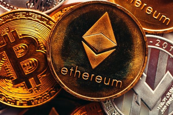 Close-up of an Ethereum coin among gold Bitcoin coins