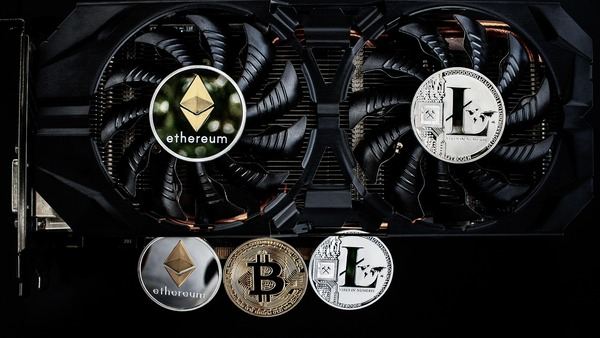 Ethereum and Litecoin coins on a graphics card with cooling fans