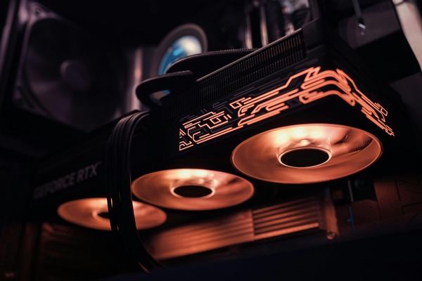 Graphics card with glowing neon circuit lines in a dark setting