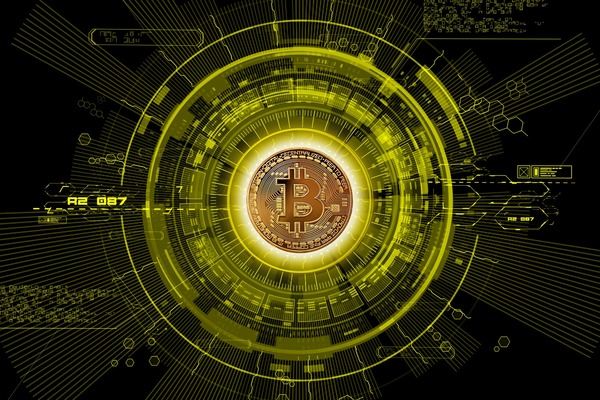 Bitcoin coin at the centre of a glowing yellow digital circle